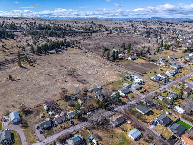 602 16th Ave E, Polson, MT 59860 - aerial overview of property's location featuring a mountainous background and a desert landscape