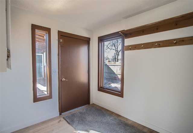602 16th Ave E, Polson, MT 59860 - foyer entrance featuring light wood-style flooring and baseboards