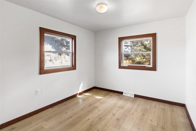 602 16th Ave E, Polson, MT 59860 - empty room featuring plenty of natural light, baseboards, and light wood-style floors