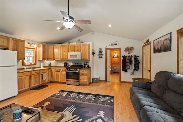 kitchen featuring light wood-style flooring, white appliances, a ceiling fan, open floor plan, and vaulted ceiling