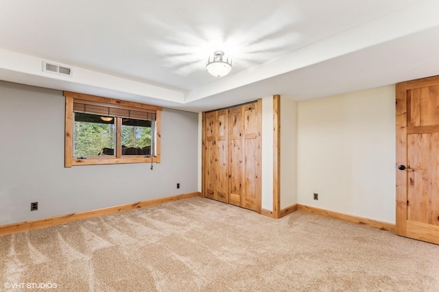 unfurnished bedroom featuring baseboards and carpet floors