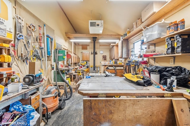misc room with a workshop area and concrete flooring