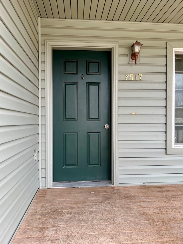 doorway to property with a porch