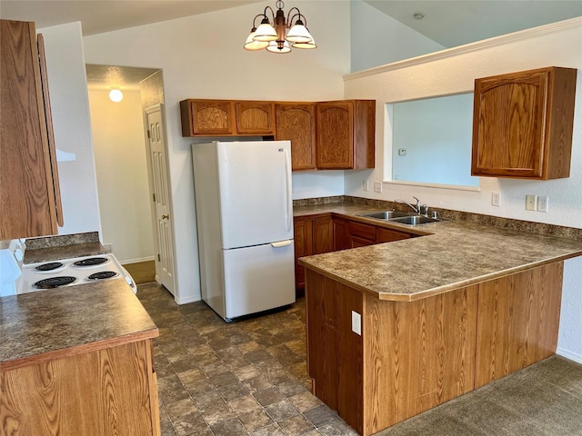 kitchen with a sink, a peninsula, brown cabinets, white appliances, and dark countertops