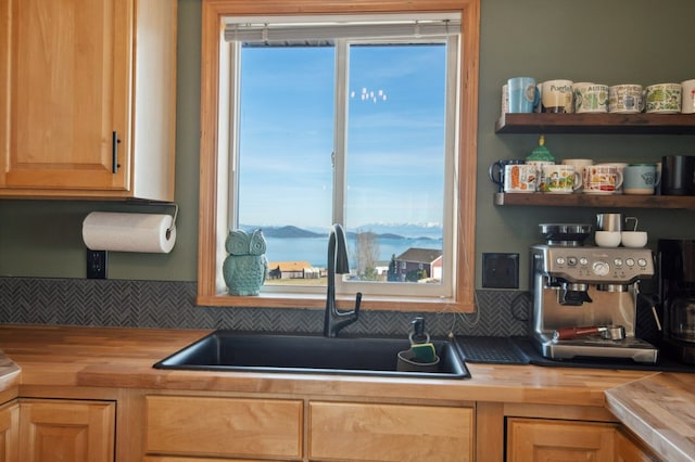 18 Mission View Dr, Polson, MT 59860 - kitchen featuring wood counters, a sink, tasteful backsplash, open shelves, and light brown cabinets