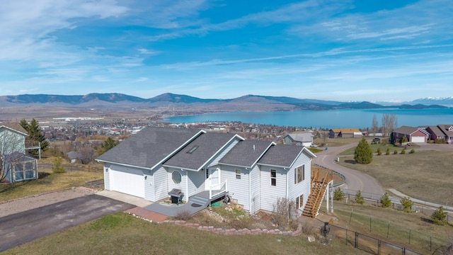 18 Mission View Dr, Polson, MT 59860 - aerial view of property and surrounding area featuring a water and mountain view