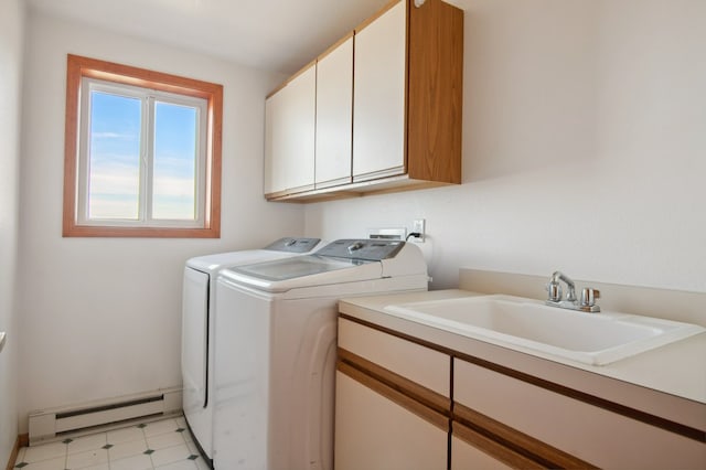 18 Mission View Dr, Polson, MT 59860 - clothes washing area with a baseboard heating unit, cabinet space, washer and dryer, and light flooring