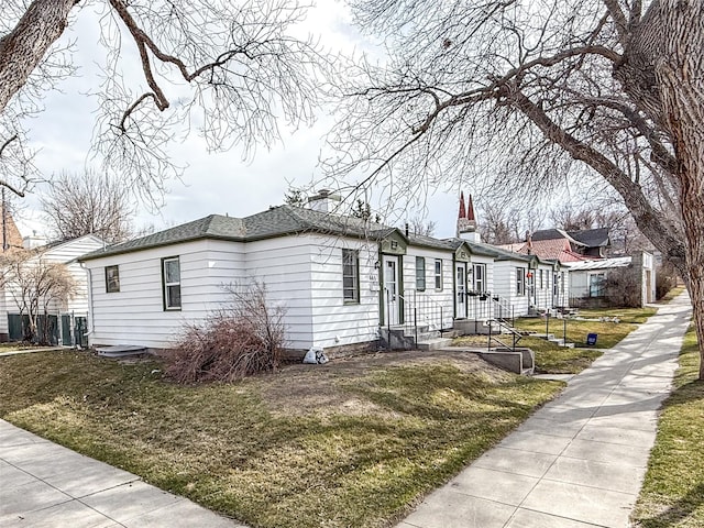 659-665 Logan St, Helena, MT 59601 - view of front of house featuring a front lawn and entry steps