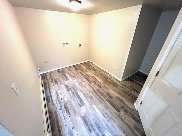 659-665 Logan St, Helena, MT 59601 - washroom featuring baseboards, washer hookup, wood finished floors, and electric dryer hookup