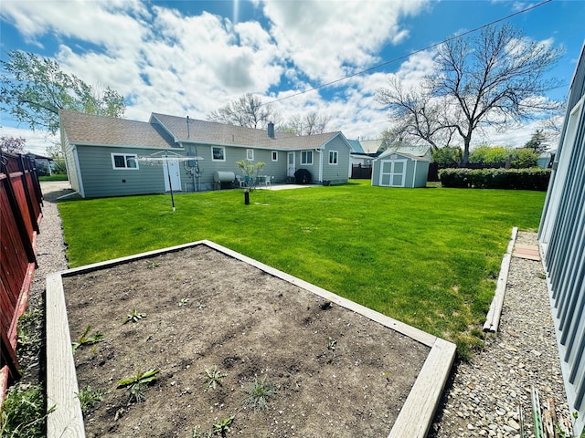 47 3rd Ave S, Stanford, MT 59479 - rear view of house featuring a shed, a garden, an outbuilding, and a patio area