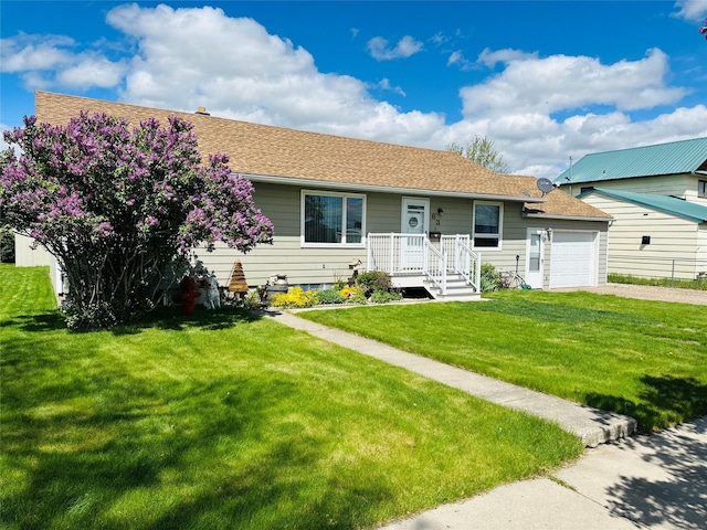 47 3rd Ave S, Stanford, MT 59479 - single story home with an attached garage, driveway, a front yard, and roof with shingles