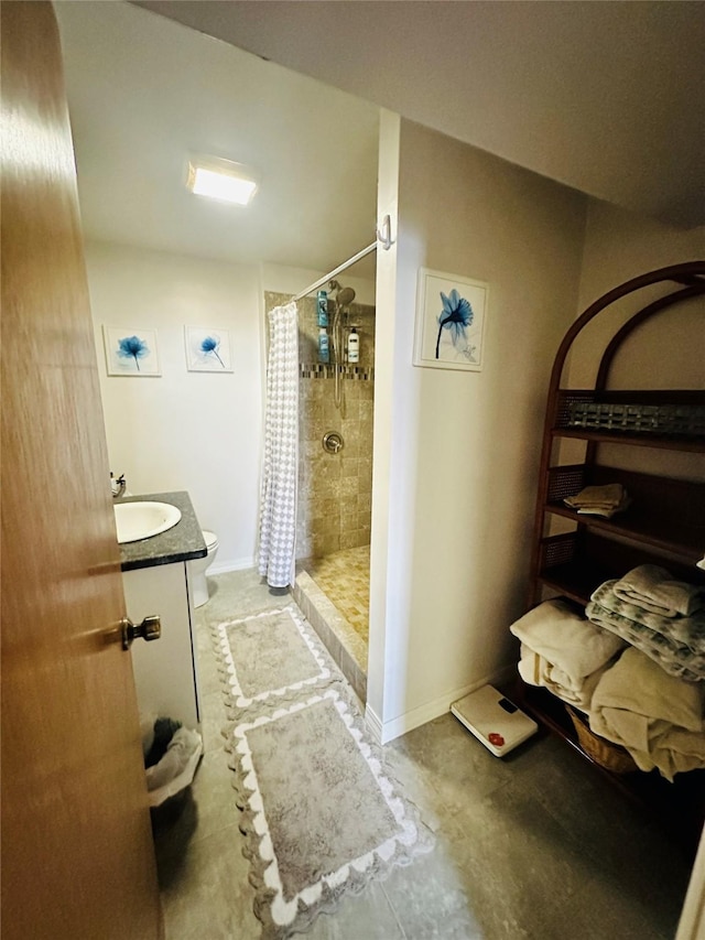 47 3rd Ave S, Stanford, MT 59479 - bathroom with a shower stall, toilet, vanity, and baseboards