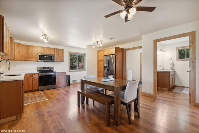 155 Spring Ln, Eureka, MT 59917 - dining room with baseboards, visible vents, wood finished floors, and a ceiling fan