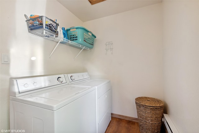 155 Spring Ln, Eureka, MT 59917 - laundry area featuring a baseboard heating unit, baseboards, washing machine and dryer, laundry area, and wood finished floors