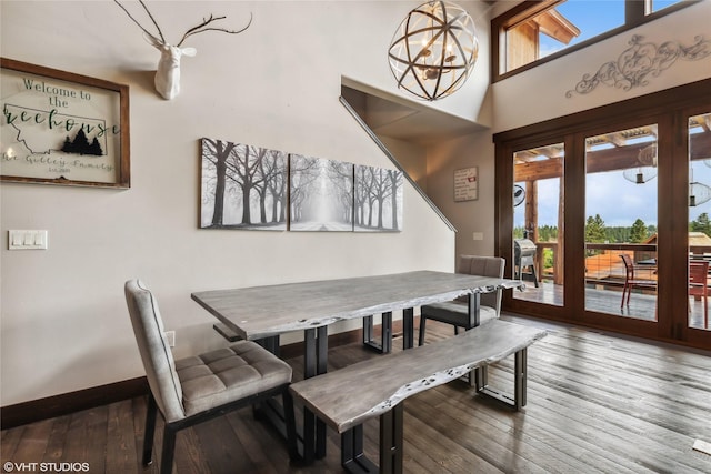 62 Wilderness Lodge Rd, Eureka, MT 59917 - dining space featuring baseboards, an inviting chandelier, and hardwood / wood-style floors