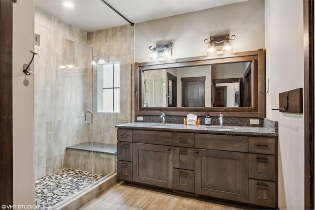 62 Wilderness Lodge Rd, Eureka, MT 59917 - full bathroom featuring double vanity, a sink, and a shower stall