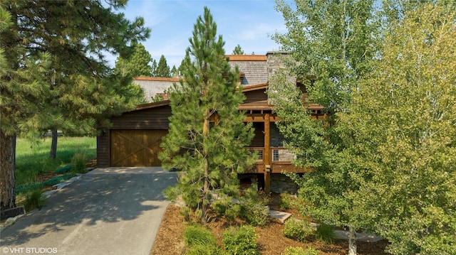 62 Wilderness Lodge Rd, Eureka, MT 59917 - exterior space featuring driveway and an attached garage