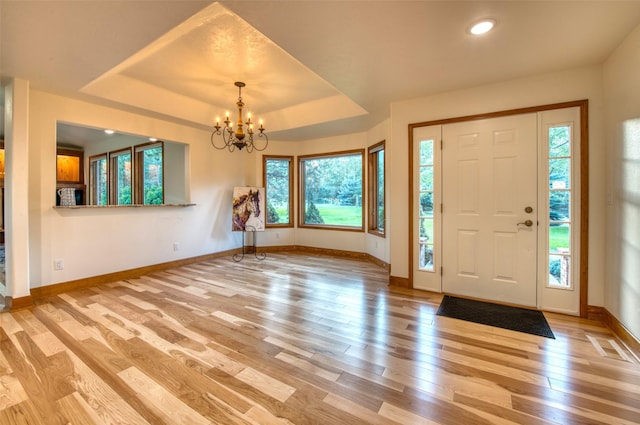 NHN Bears Rd, Stevensville, MT 59870 - foyer featuring visible vents, baseboards, wood finished floors, a raised ceiling, and a notable chandelier