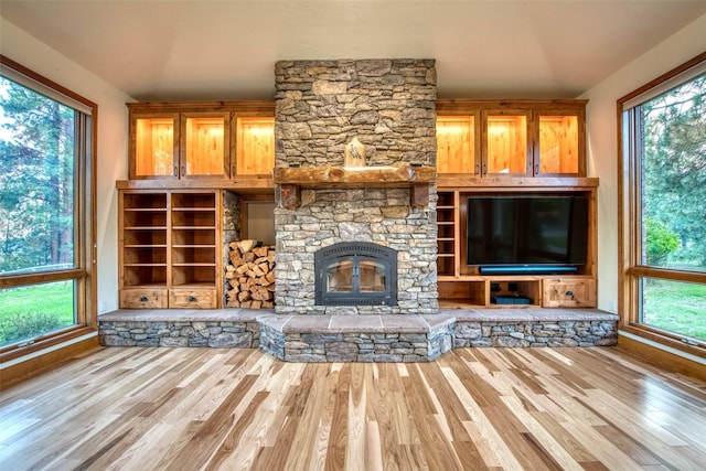 NHN Bears Rd, Stevensville, MT 59870 - unfurnished living room featuring a fireplace, wood finished floors, and a wealth of natural light