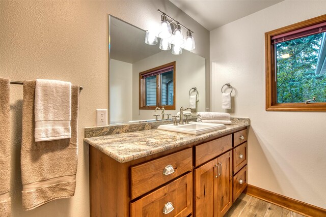 NHN Bears Rd, Stevensville, MT 59870 - bathroom with vanity, baseboards, and wood finished floors