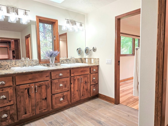 NHN Bears Rd, Stevensville, MT 59870 - full bathroom featuring double vanity, a sink, and wood finished floors