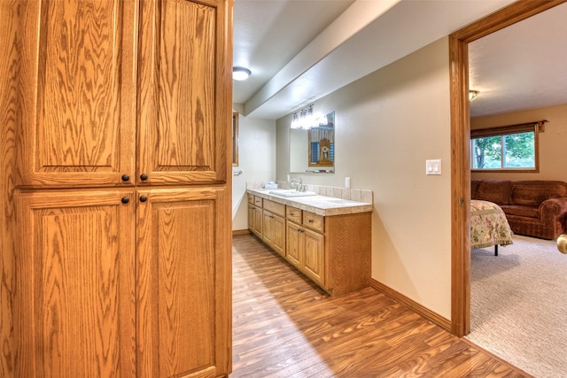 NHN Bears Rd, Stevensville, MT 59870 - bathroom featuring vanity, baseboards, and wood finished floors