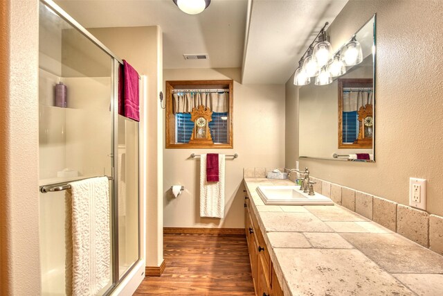 NHN Bears Rd, Stevensville, MT 59870 - bathroom featuring visible vents, baseboards, wood finished floors, vanity, and a stall shower