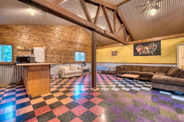 NHN Bears Rd, Stevensville, MT 59870 - living area with tile patterned floors, beamed ceiling, high vaulted ceiling, and wood walls