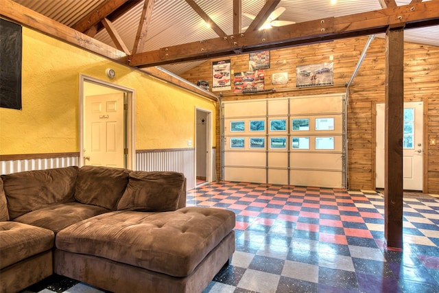 NHN Bears Rd, Stevensville, MT 59870 - living room with tile patterned floors, beamed ceiling, wood walls, and a garage