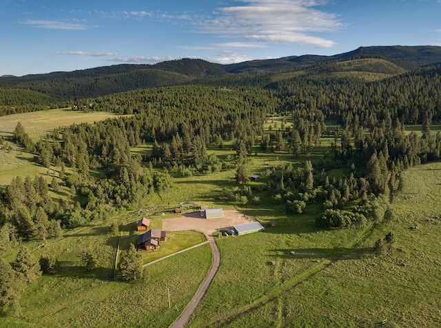 587 Cozy Ln, Helmville, MT 59843 - aerial view with a mountain view, a view of trees, and a rural view