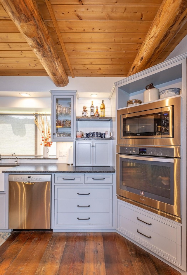 587 Cozy Ln, Helmville, MT 59843 - kitchen with dark wood finished floors, wood ceiling, appliances with stainless steel finishes, and open shelves