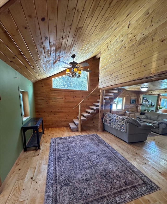 28 Princeton Rd, Philipsburg, MT 59858 - living area featuring wooden walls, hardwood / wood-style floors, lofted ceiling, wooden ceiling, and stairs