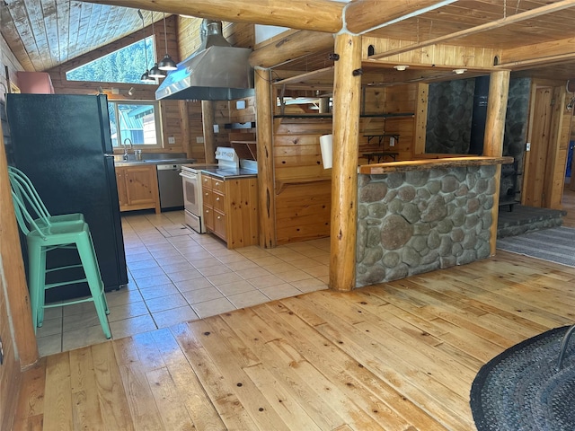 28 Princeton Rd, Philipsburg, MT 59858 - kitchen featuring electric range, range hood, light wood-style floors, dishwasher, and freestanding refrigerator