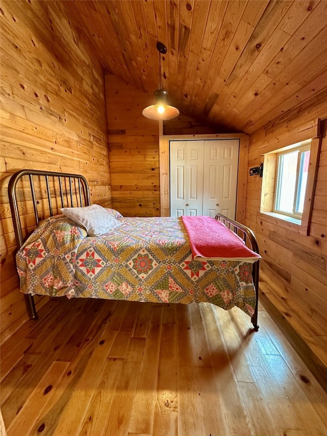 28 Princeton Rd, Philipsburg, MT 59858 - bedroom with wooden walls, wood-type flooring, lofted ceiling, wooden ceiling, and a closet