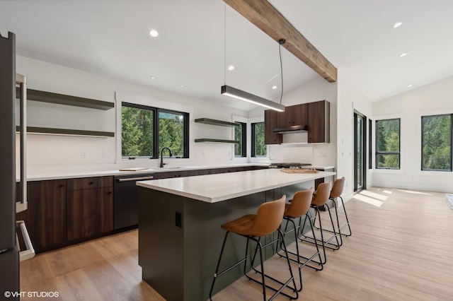 34 Grizzly Ct, Bigfork, MT 59911 - kitchen featuring open shelves, dishwashing machine, dark brown cabinets, a breakfast bar area, and recessed lighting