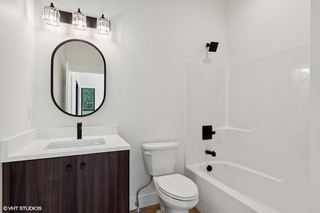 34 Grizzly Ct, Bigfork, MT 59911 - bathroom with toilet, vanity, baseboards, and bathing tub / shower combination