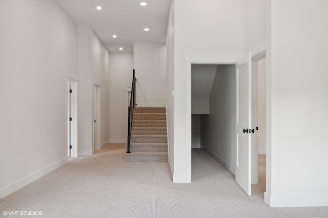 34 Grizzly Ct, Bigfork, MT 59911 - stairs featuring recessed lighting, carpet flooring, and baseboards