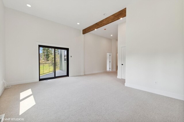 34 Grizzly Ct, Bigfork, MT 59911 - spare room featuring light colored carpet, recessed lighting, and beamed ceiling