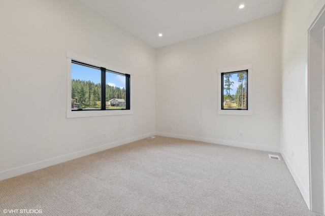 34 Grizzly Ct, Bigfork, MT 59911 - carpeted empty room featuring healthy amount of natural light and recessed lighting