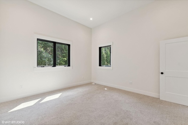 34 Grizzly Ct, Bigfork, MT 59911 - unfurnished room featuring light colored carpet and baseboards