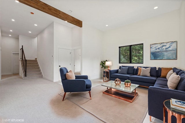 34 Grizzly Ct, Bigfork, MT 59911 - living room with stairs, recessed lighting, light carpet, baseboards, and beamed ceiling