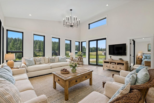 34 Grizzly Ct, Bigfork, MT 59911 - living area with a chandelier, light wood-style flooring, a high ceiling, and recessed lighting