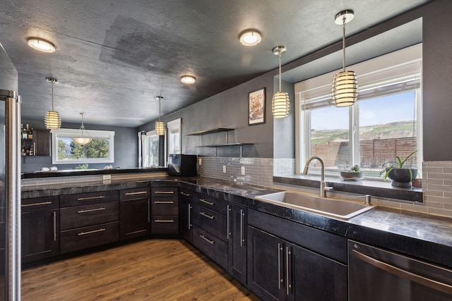 4528 Adellon Ct, Stevensville, MT 59870 - kitchen featuring dishwasher, dark countertops, dark wood-style flooring, open shelves, and backsplash