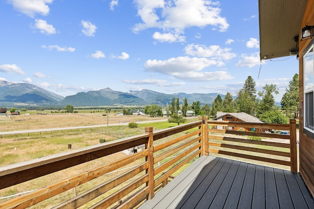 4528 Adellon Ct, Stevensville, MT 59870 - wooden terrace with a mountain view and a view of countryside