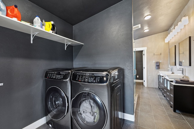 4528 Adellon Ct, Stevensville, MT 59870 - laundry room featuring separate washer and dryer and tile patterned floors