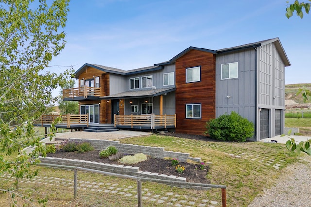 4528 Adellon Ct, Stevensville, MT 59870 - view of front of property with a balcony, an attached garage, driveway, and a front yard