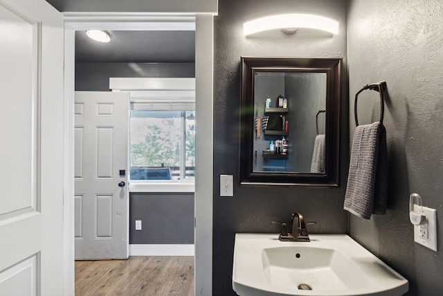 4528 Adellon Ct, Stevensville, MT 59870 - bathroom with a sink and wood finished floors