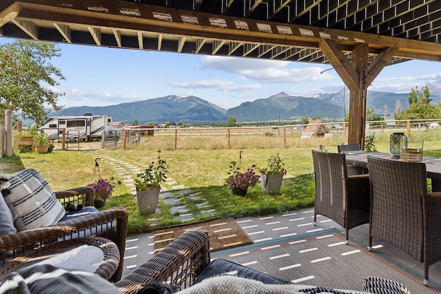 4528 Adellon Ct, Stevensville, MT 59870 - view of patio featuring a mountain view, a view of rural / pastoral area, and outdoor dining space