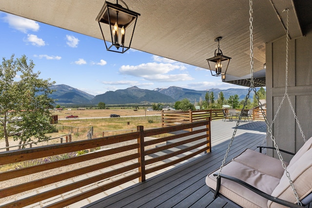 4528 Adellon Ct, Stevensville, MT 59870 - wooden terrace featuring a mountain view and a view of rural / pastoral area