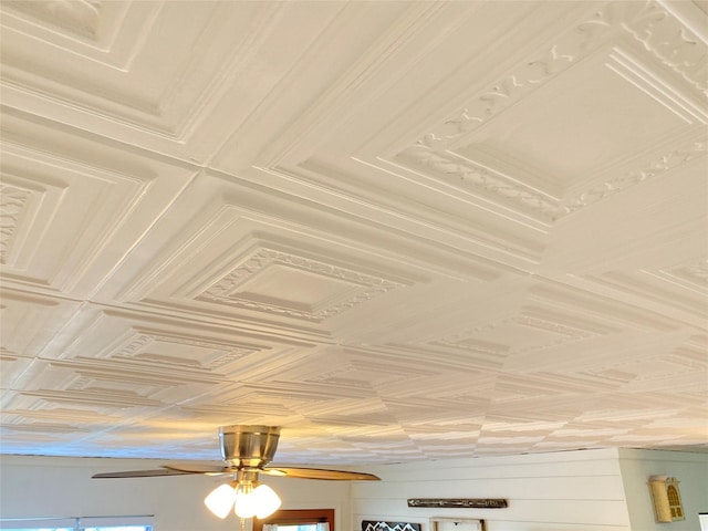 details with an ornate ceiling and a ceiling fan